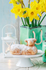 Sticker - Easter table with lamb cake, bouquet of daffodils and painted eggs.