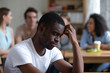 © fizkes - Sad African American man suffering from bullying or racial discrimination