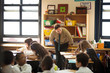 © Cavan Images - Teacher talking with students (8-9, 10-11)
