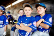 © Cavan Images - Little league players (8-9, 10-11) goofing around in dugout