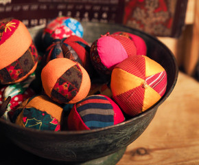 patchwork toy balls lie in the basket. Russian traditional