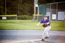 Young Baseball Player (8-9) Throwing Ball 