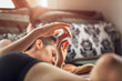 © Cavan Images - Girlfriends in bed