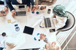 © alfa27 - engineers are discussing a contract.oil industry. engineering. marketing. Arab expert is teaching colleagues to manage with finance. top view