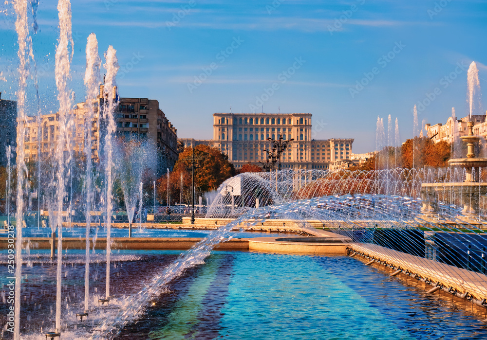 Obraz na płótnie Famous building of Parliament house in Bucharest, the bigest landmark of Romania near the new fountains of capital. w salonie