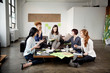 © Cavan Images - Group of businesswomen discussing project in office