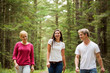 © Cavan Images - Teen friends (16-17) walking together in forest
