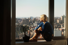 New York City,  Young Woman Looking At City 