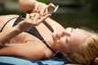© Cavan Images - Young woman listening to mp3 player