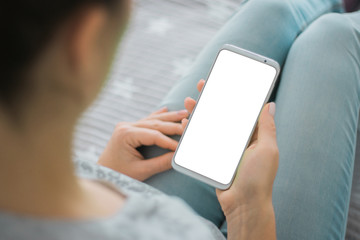 Wall Mural - Mockup image of woman's hands. chroma key. holding mobile phone white screen smartphone. close up.