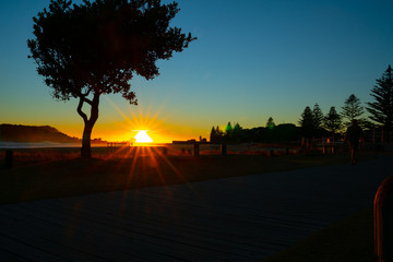 Wall Mural - Intense sunrise at Mount Maunganui