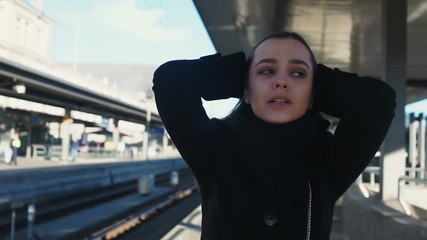 desperate woman standing on platform, late for train, lost her last chance
