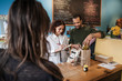 © Cavan Images - Sales clerks working
