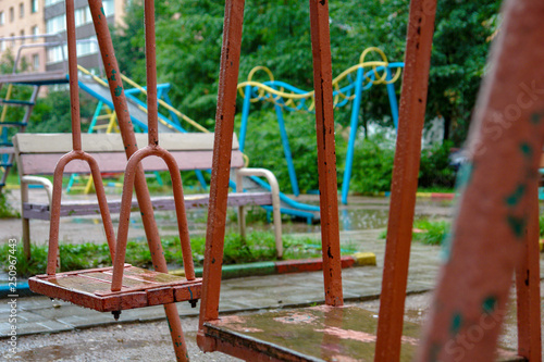 Old Children S Swing On The Playground In The Rain Concept