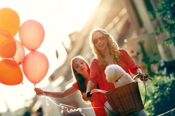 Poster - Mother and daughter ride a bicycle