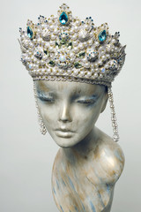 Mannequin head in creative Russian white kokoshnick with jewels and pearls