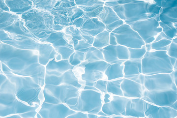 Texture of water in swimming pool for background