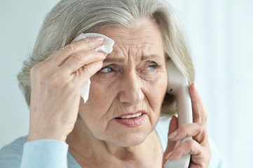 Wall Mural - Close up portrait of upset senior woman