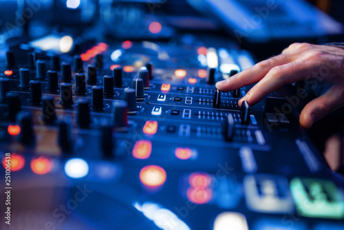 Photographie  Sound operator hands at the volume control panel