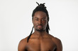 © Alexandr - handsome stylish african man with dreadlocks hair on a white background