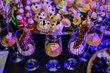 © Med Photo Studio - Buffet table with snacks, canapes and appetizers at a birthday party; nuggets with sauce, pieces of salmon with sauce in glasses