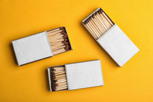 Cardboard Boxes With Matches On Color Background, Flat Lay. Space For Design