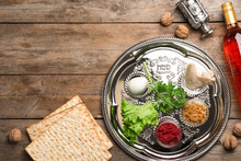 Flat Lay Composition With Symbolic Passover (Pesach) Items On Wooden Background, Space For Text