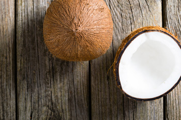 Wall Mural - coconuts on natural old wood table background