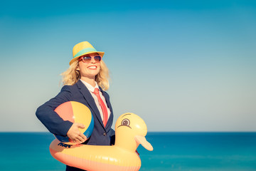 Wall Mural - Successful young businesswoman on a beach