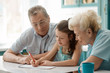 © yuriygolub - Grandaughter drawing a picture