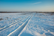 Traces Of The Vehicle On The Snow Towards The Horizon