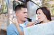 © Andy Dean - Young Lost and Confused Military Couple Looking at Map In Front of RV