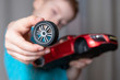 © Ivan Zhdan - boy broke the toy. broken wheel from the car