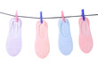 © splitov27 - Women's  socks are hanging on clothespins clothesline isolated on white background.