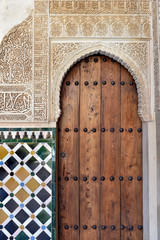 Ornate door in one of the Nasrid Palaces in the Alhambra complex, Granada, Andalusia, Spain