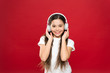 © be free - Music taste. Music plays an important part lives teenagers. Powerful effect music teenagers their emotions, perception of world. Girl listen music headphones on red background. Play list concept