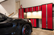© tab62 - Home garage interior highly organized and clean with parked car