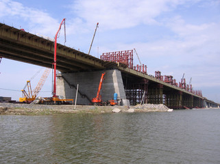 construction Bugrinskij bridge in Novosibirsk on the river Ob a pile of large stones for building construction