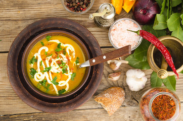 Vegetable puree, vegetarian soup with sour cream and greens.