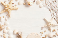 White Textured Wooden Surface Decorated With Sea Shells