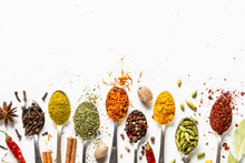Set Of Various Spices In Spoons On White