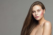 © inarik - Woman Beauty Portrait, Fashion Model Makeup and Long Straight Hair, Beautiful Girl over studio gray background