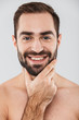 © Drobot Dean - Close up of a young handsome bearded shirtless man