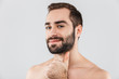 © Drobot Dean - Close up of a young handsome bearded shirtless man