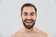 © Drobot Dean - Close up of a young handsome bearded shirtless man