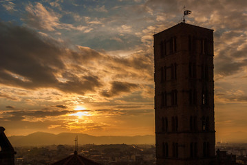 Wall Mural - View of Arezzo historic center sunset skyline with medieval tower and tuscany hills in the background