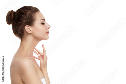 Cuadros en Lienzo Young beautiful woman touching her neck
