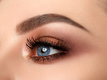 Close-up Of Woman Eye With Beautiful Brown Smokey Eyes Makeup