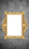 Fototapeta  - Gold Color Antique Vintage Classic Baroque Stylish Empty Photo Painting Frame in Grunge and Retro Background for Home Interior and Garden Furniture made from Wood and Metal