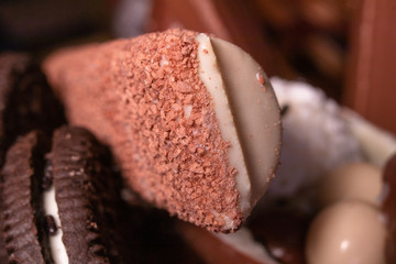 Wall Mural - Chocolate, chocolate cookies and candies like a decoration on homemade cake